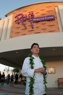 Roy Yamaguchi in front of his Chandler Restaurant